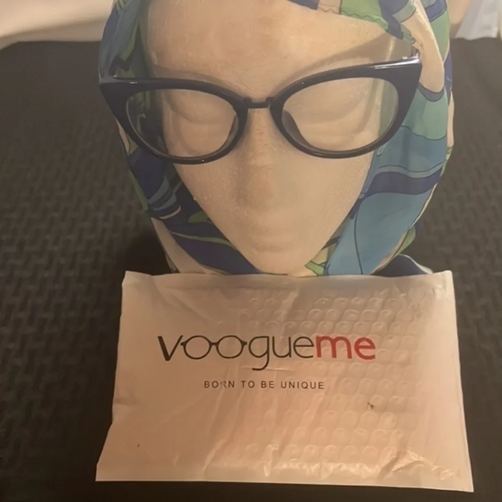 Royal blue plastic frame with metal arms. From Vooogue Me.